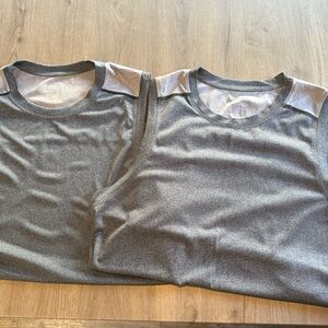 TWO orange theory mens tanks